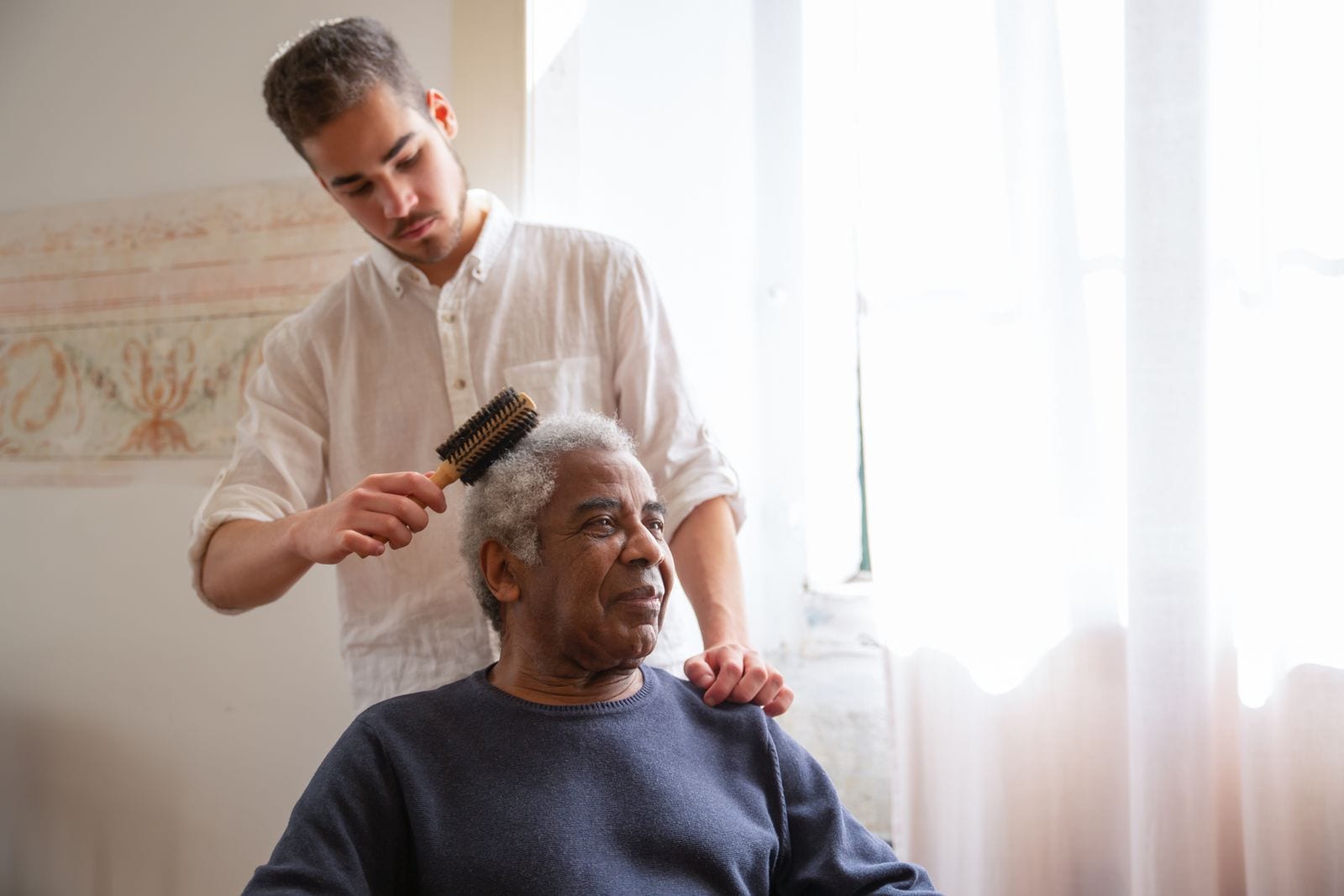 Caregiver supporting a senior at home